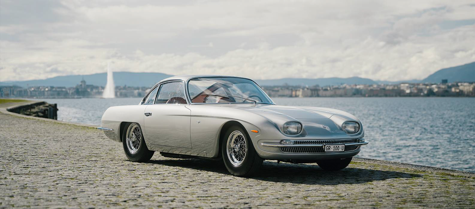 Lamborghini 350 GT by the lake with mountains