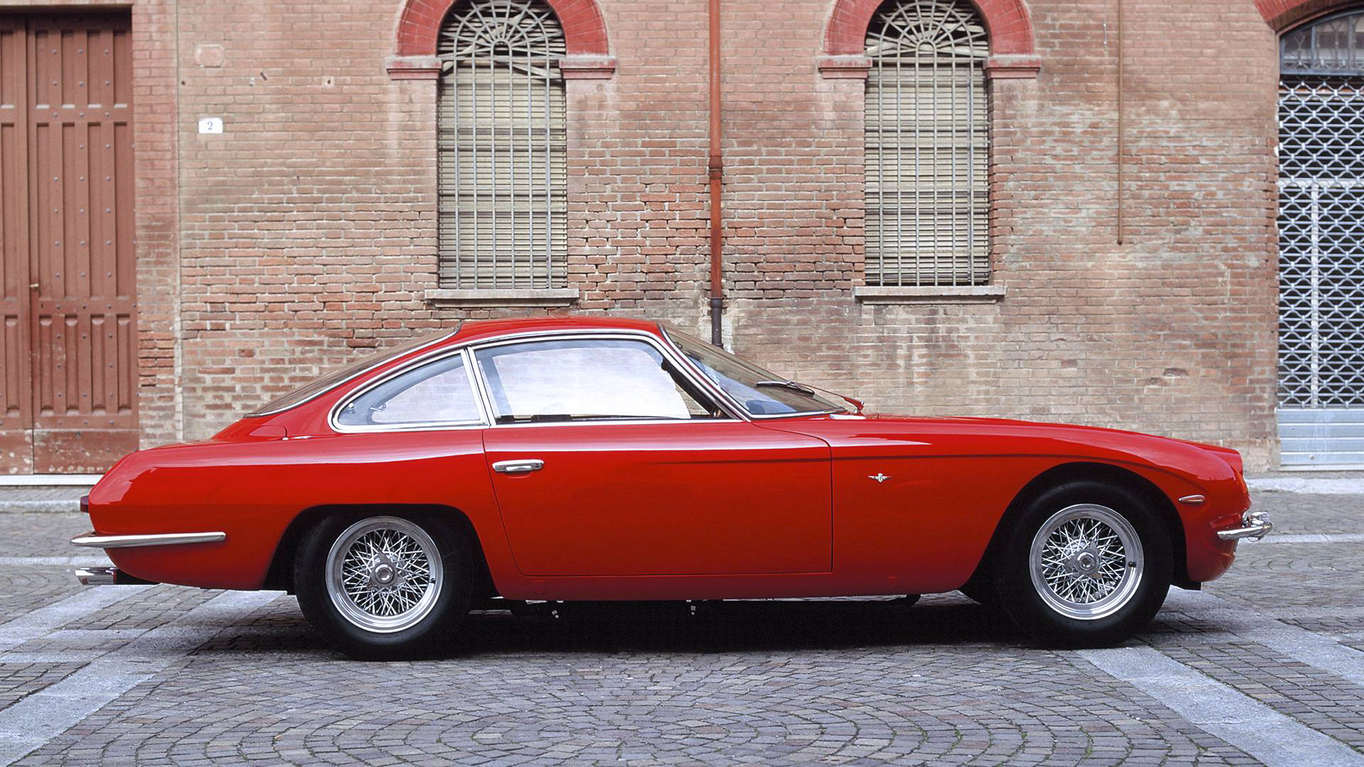 Red Lamborghini 350 GT on cobblestones